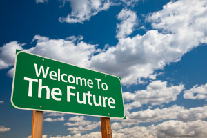 Welcome To The Future Green Road Sign with Copy Room Over The Dramatic Clouds and Sky.